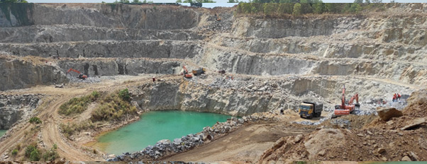 Aerial view of an active quarry with excavation equipment